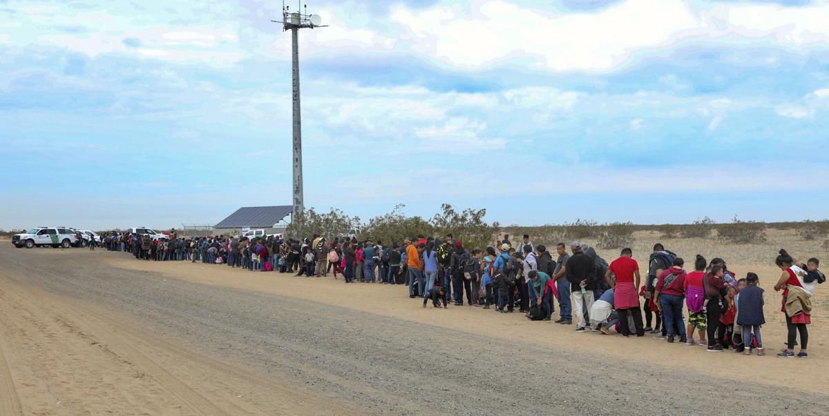 Migrants waiting to be processed